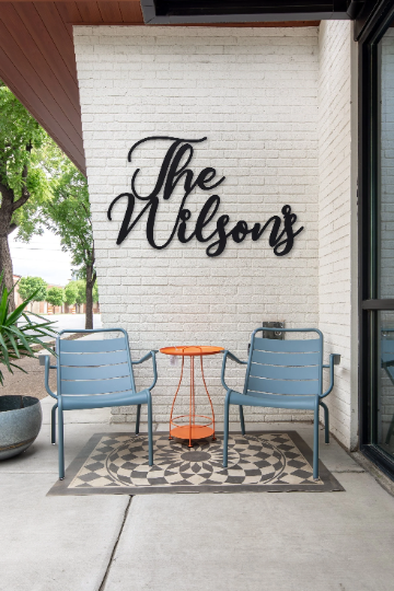 “The Wilsons” script wall sign in black powder coat finish