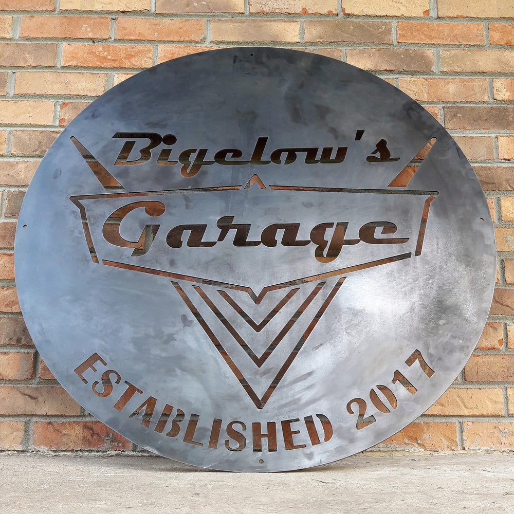 Custom round garage sign with retro lettering and car-inspired design
