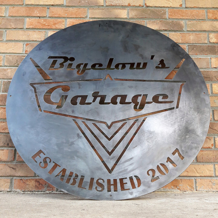 Custom round garage sign with retro lettering and car-inspired design