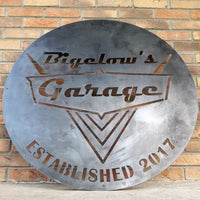 Thumbnail for This is a rustic round metal garage sign which reads, 