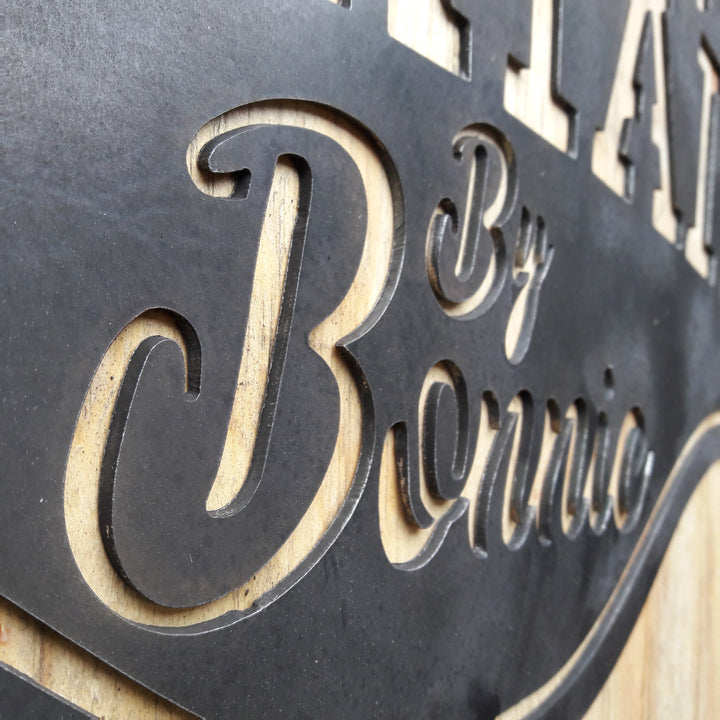 This metal bar sign reads, " Classic Cocktails By Bonnie"