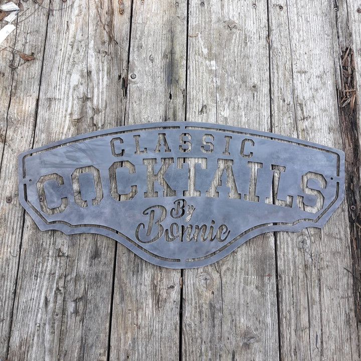 This metal bar sign reads, " Classic Cocktails By Bonnie"