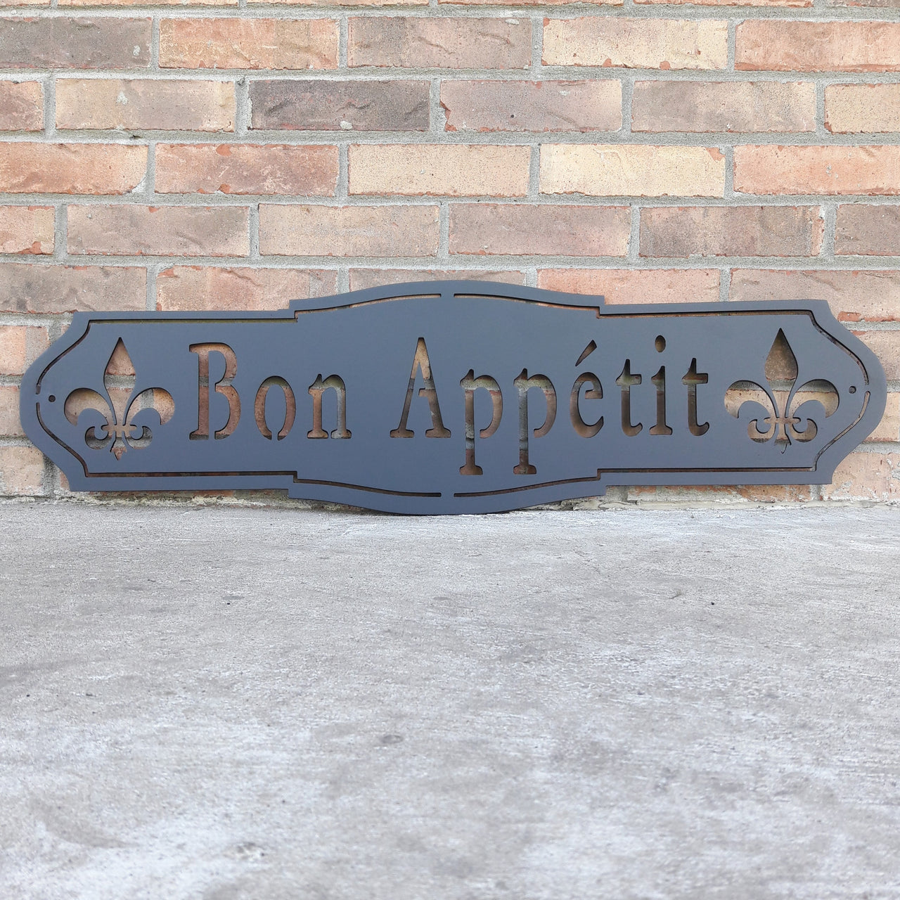 French country, outdoor black powder coat, metal sign which reads, "Bon Apetit"