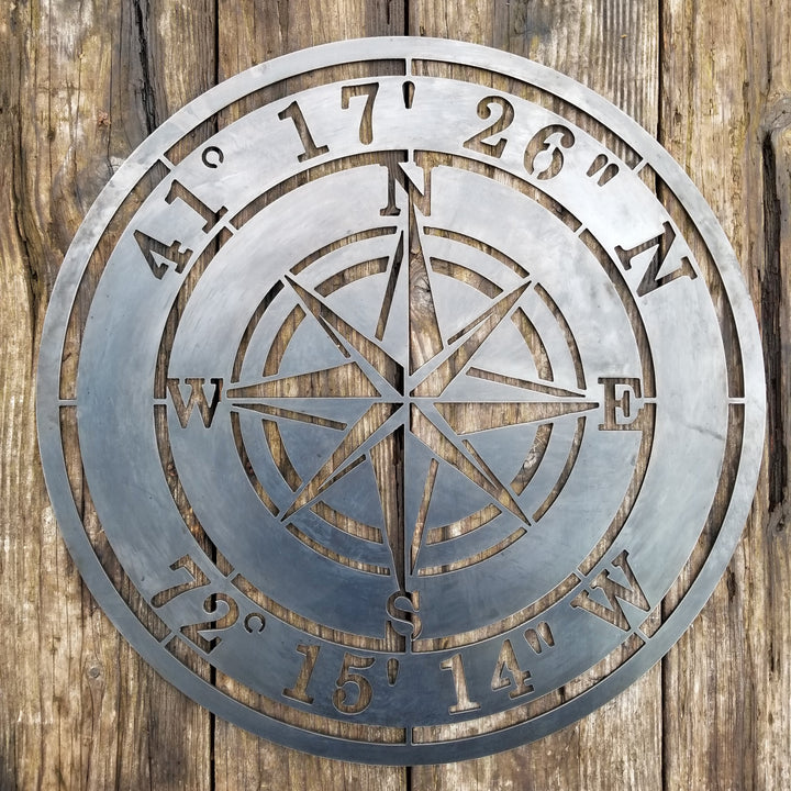 Steel compass rose sign with GPS engraving