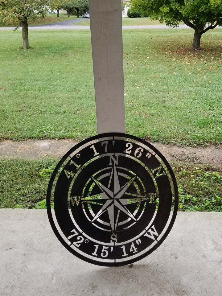 Metal Compass Rose With Coordinates. The coordinates read, "41 17 26 N 72 15 14 W"