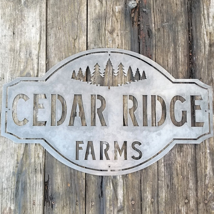 This is a rustic metal sign showcasing an image of trees at the top. The sign reads, "Cedar Ridge Farms".