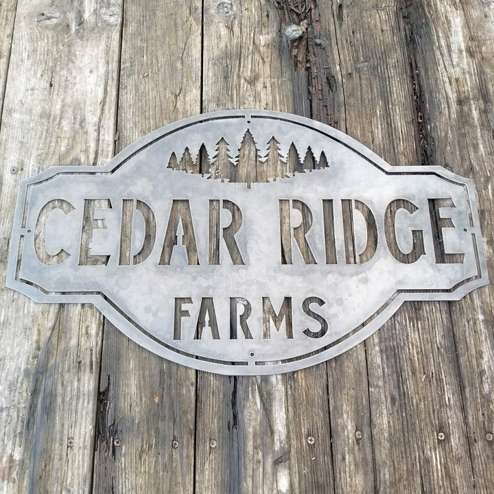 This is a rustic metal sign showcasing an image of trees at the top. The sign reads, "Cedar Ridge Farms".