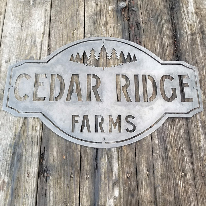 This is a rustic metal sign showcasing an image of trees at the top. The sign reads, "Cedar Ridge Farms".