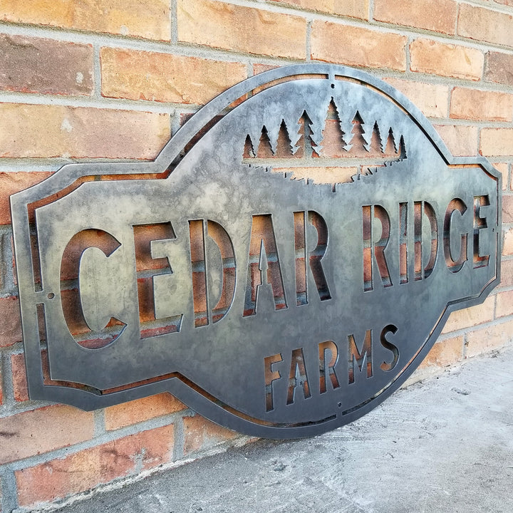 This is a rustic metal sign showcasing an image of trees at the top. The sign reads, "Cedar Ridge Farms".