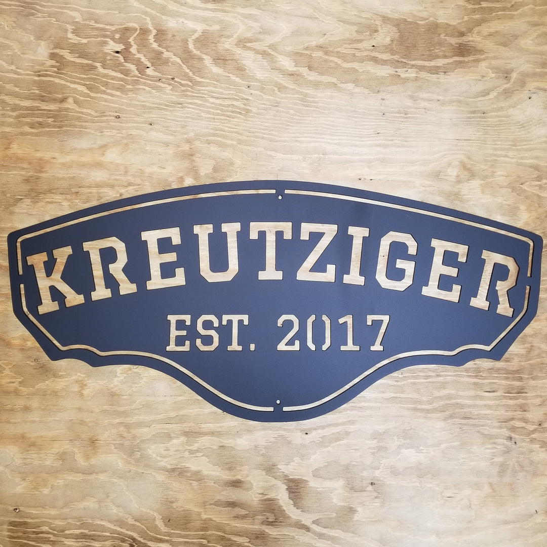 This personalized metal sign reads, "KREUTZIGER Est. 2017".