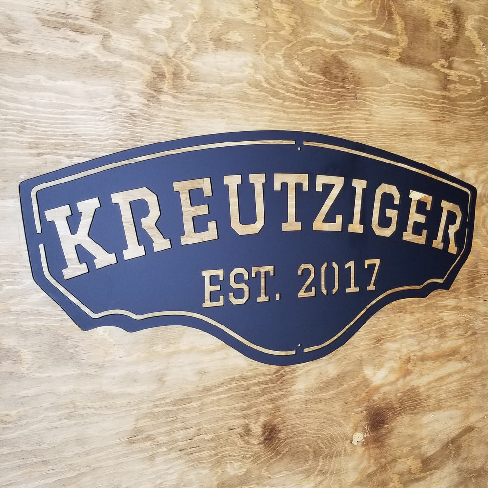 This personalized metal sign reads, "KREUTZIGER Est. 2017".
