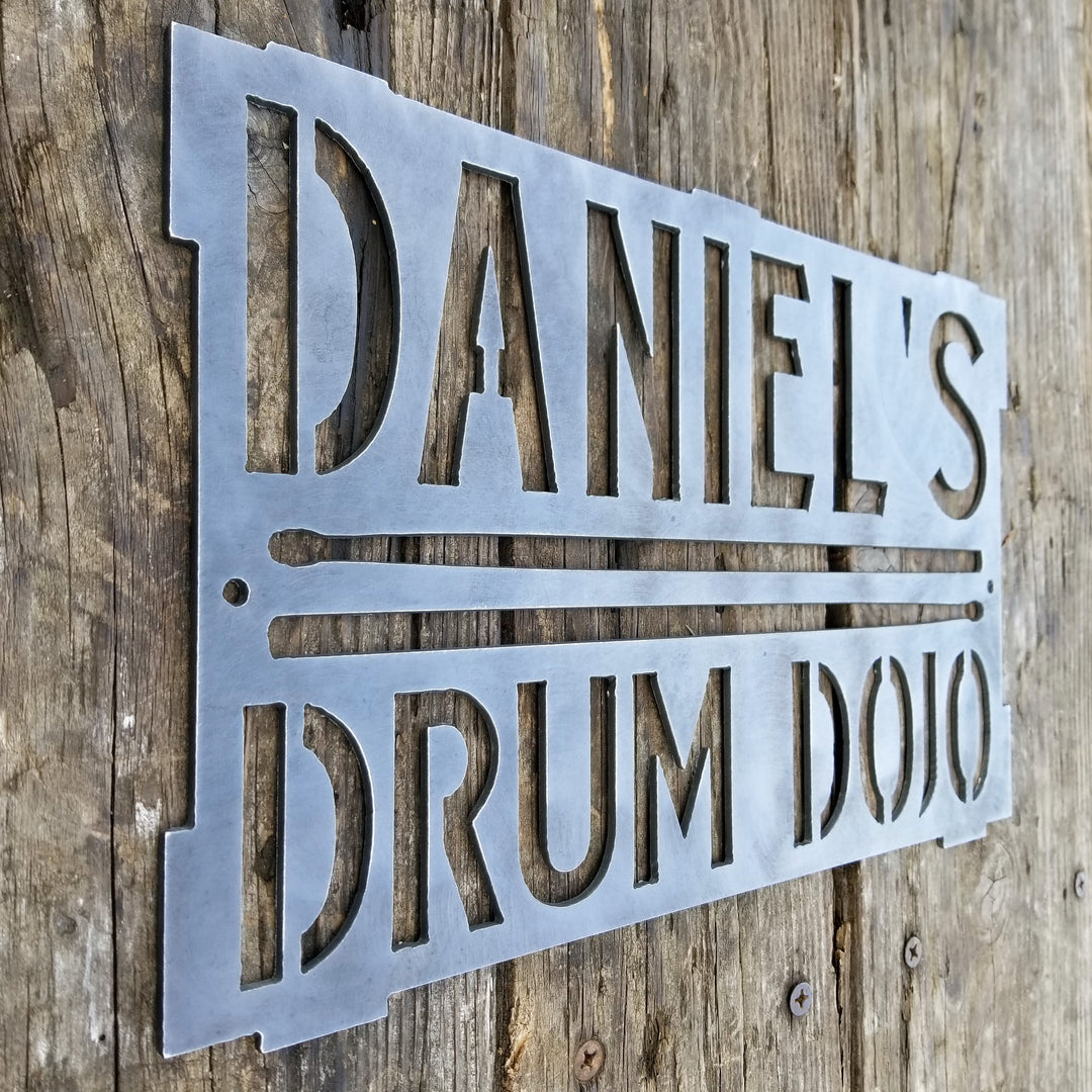 This is a rectangular sign that reads, "Daniel's Drum Dojo".