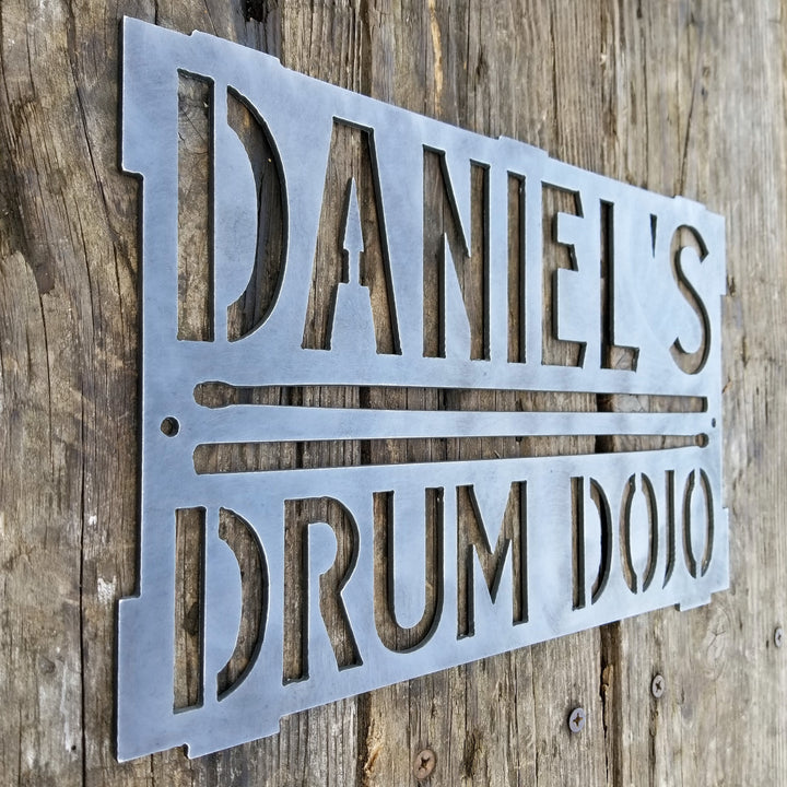 This is a rectangular sign that reads, "Daniel's Drum Dojo".