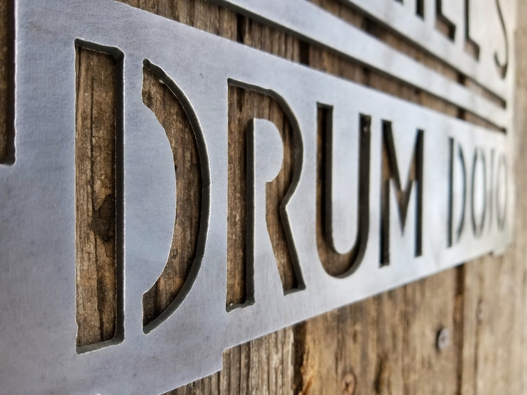 This is a rectangular sign that reads, "Daniel's Drum Dojo".
