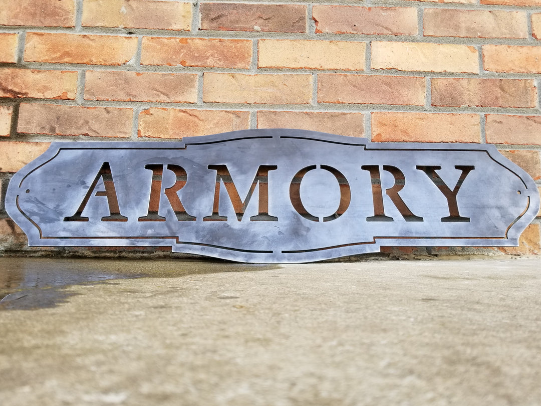 This sign has a classic shape and reads, "ARMORY"
