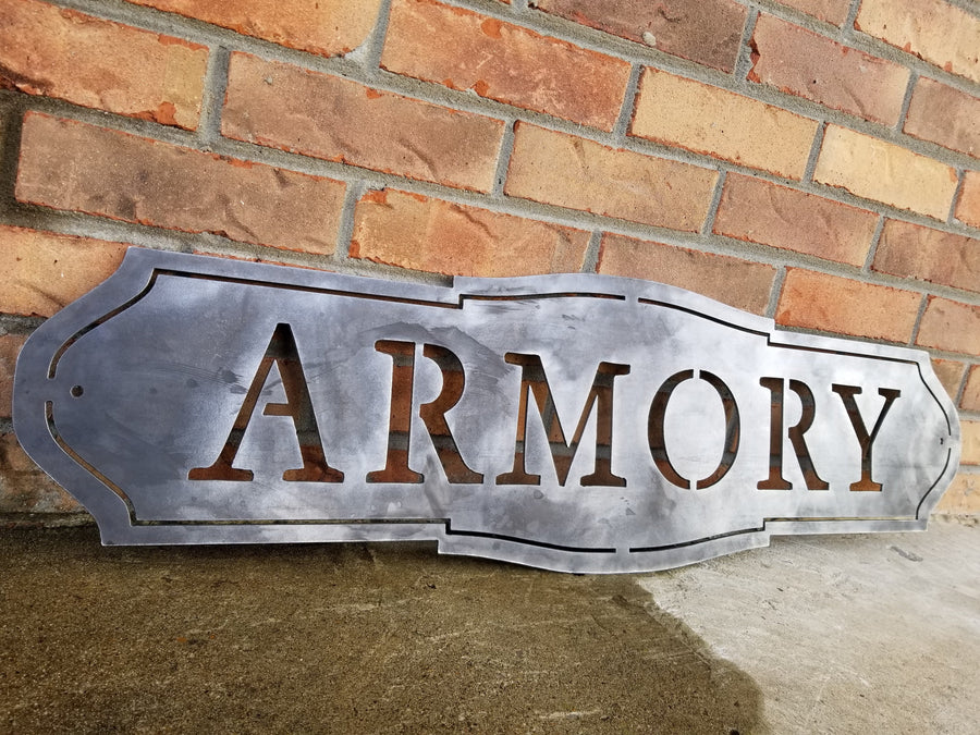 This sign has a classic shape and reads, "ARMORY"