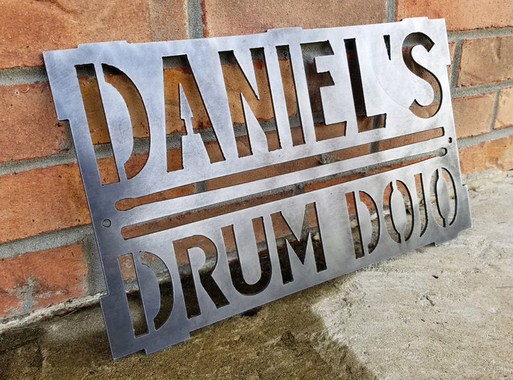This is a rectangular sign that reads, "Daniel's Drum Dojo".