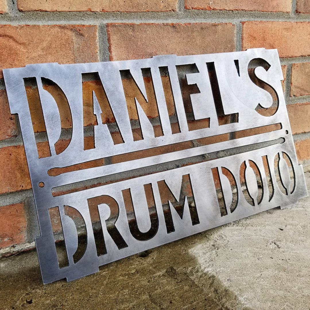 This is a rectangular sign that reads, "Daniel's Drum Dojo".