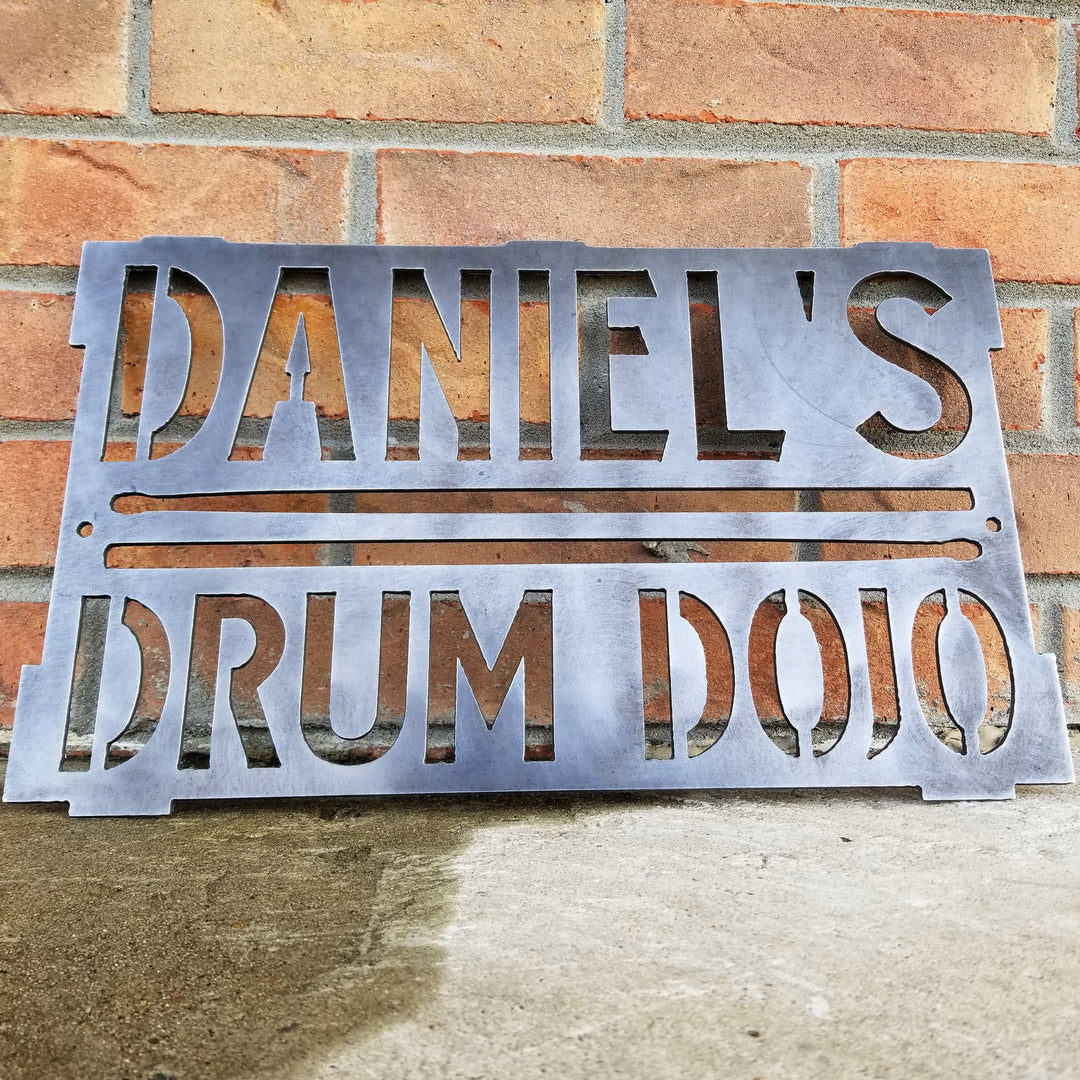 This is a rectangular sign that reads, "Daniel's Drum Dojo".