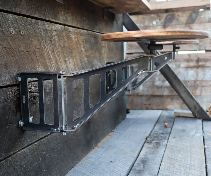 Industrial folding bar stool with wall mount bracket and wooden seat