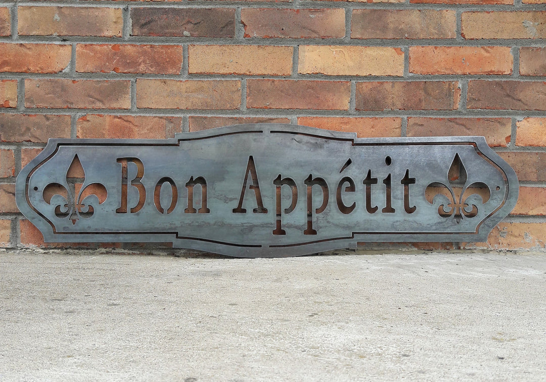 French country, raw steel, metal sign which reads, "Bon Apetit"
