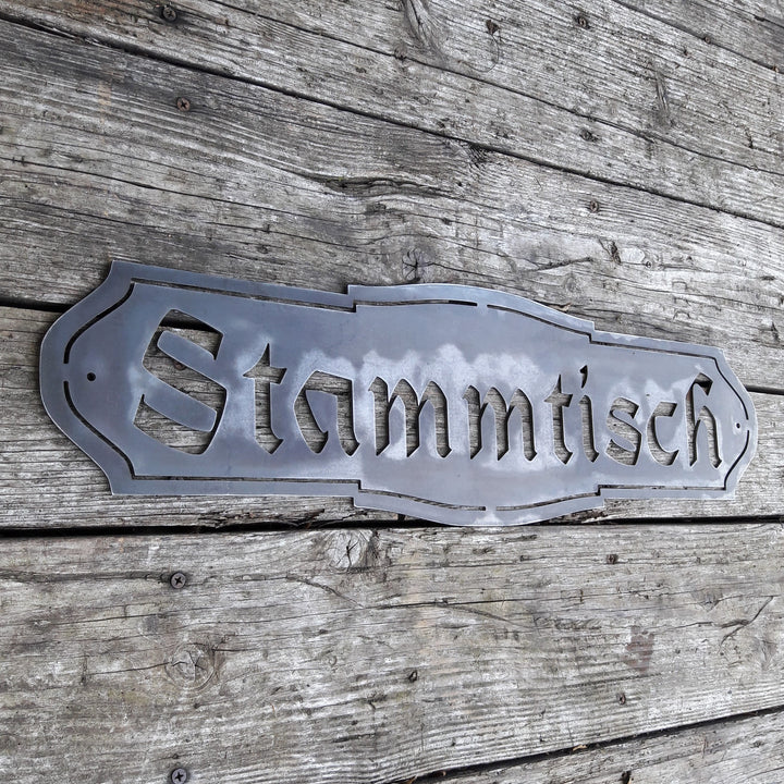This Metal Sign is written in German and reads, " Stammtisch"
