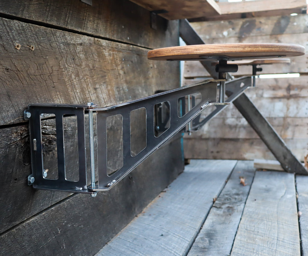 Swing-away bar stool detail, hand-welded steel bracket | Maker Table