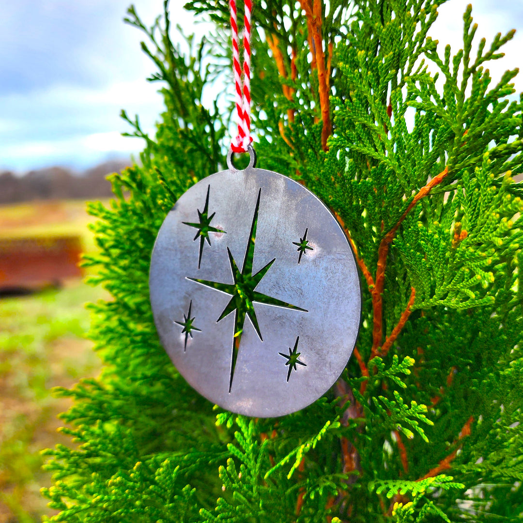 steel Christmas ornament with star cutouts