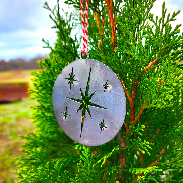 steel Christmas ornament with star cutouts