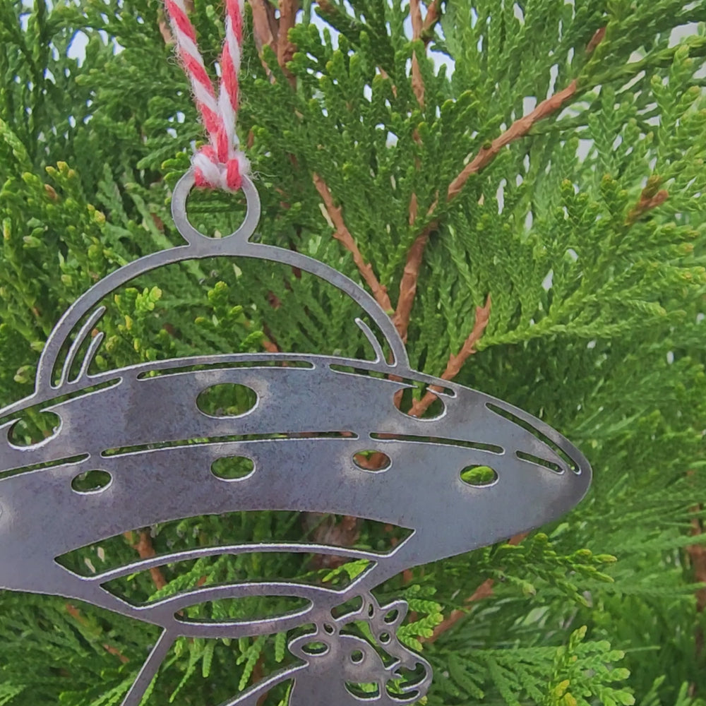 steel alien ornament with cow beam cutout