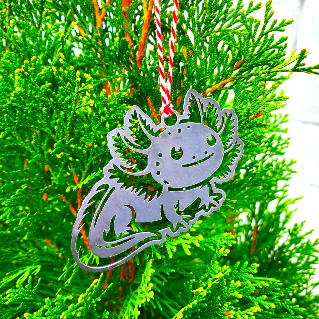 • adorable amphibian ornament made from raw steel
