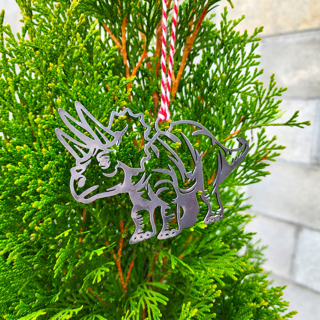 prehistoric metal ornament on branch