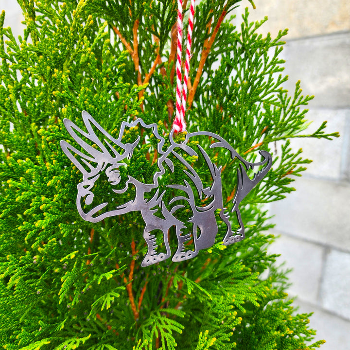 prehistoric metal ornament on branch