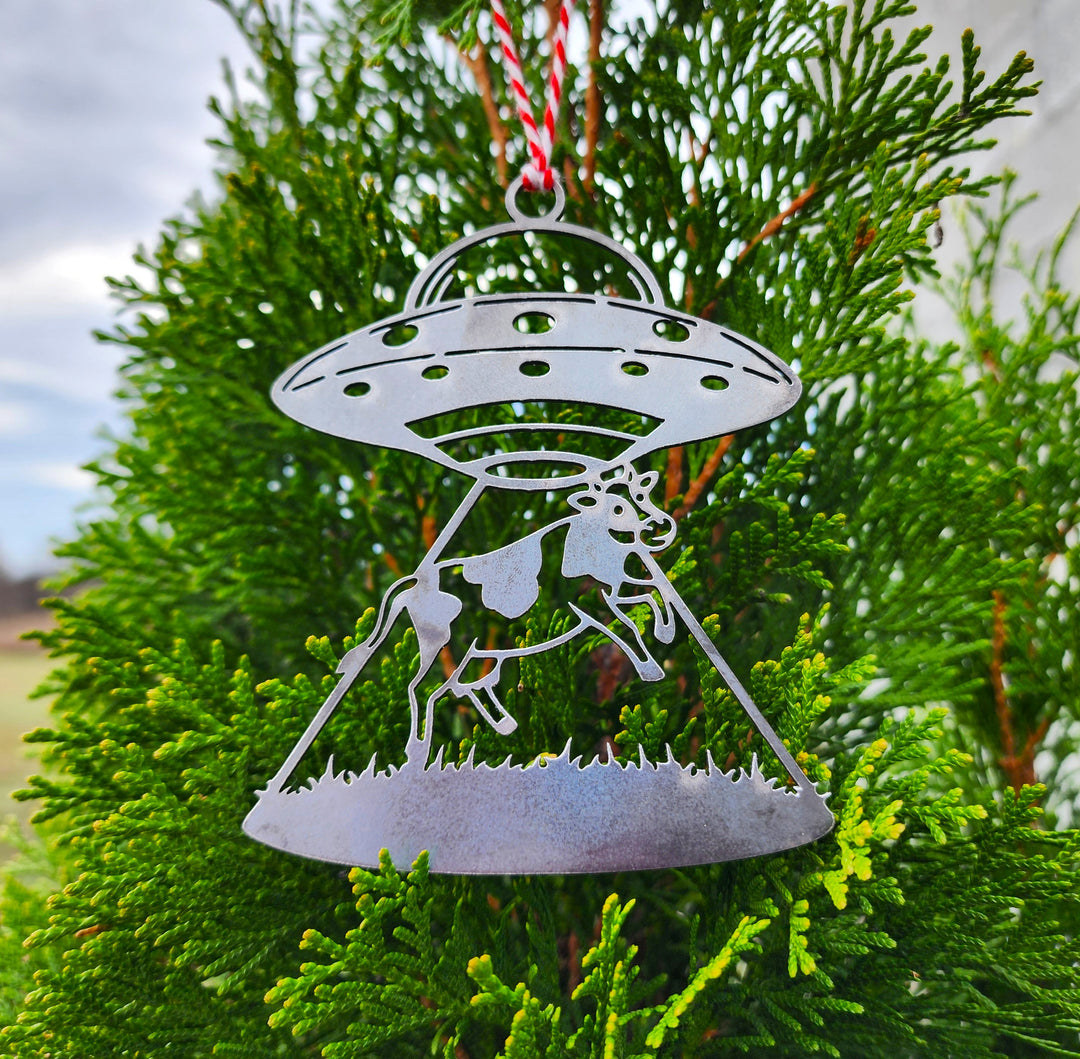 rustic steel UFO ornament on tree