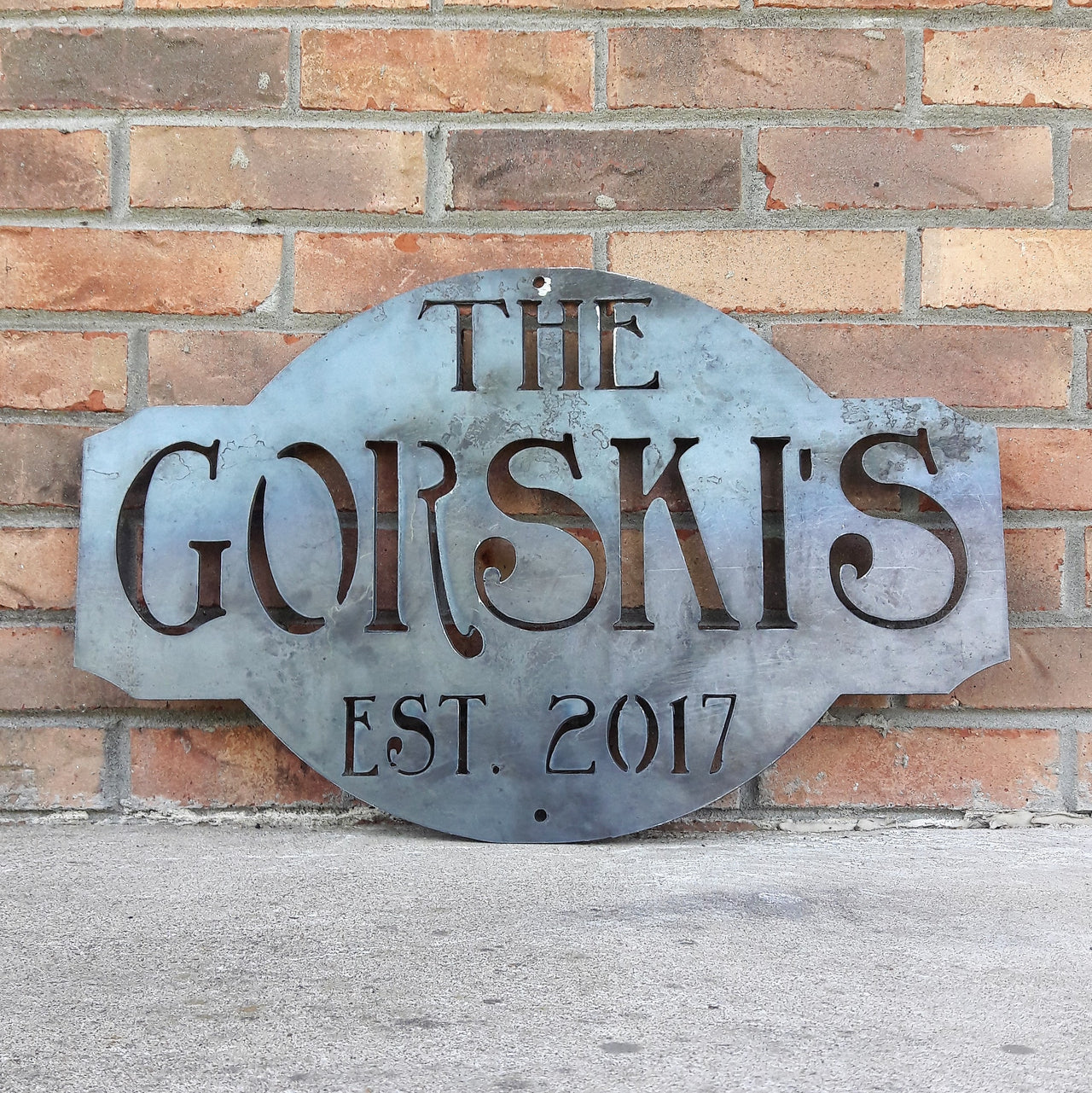 Rustic  raw steel metal sign. The sign reads, " The Gorski's est. 2017"