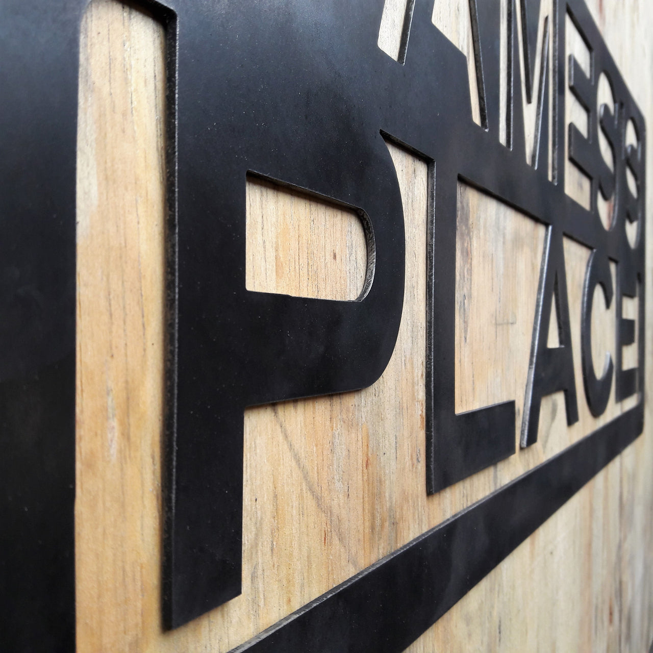 This is a custom metal sign that reads, "James's Place".
