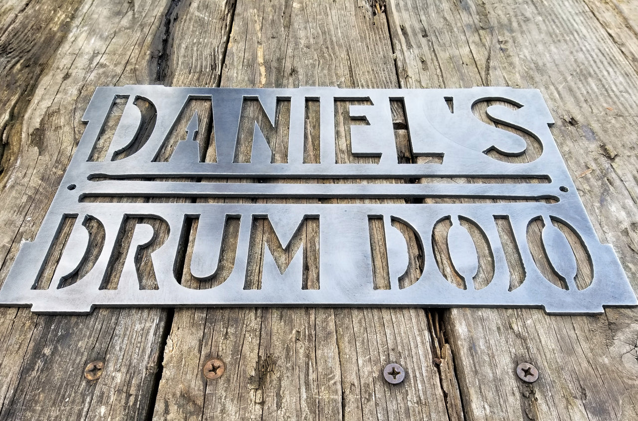 This is a rectangular sign that reads, "Daniel's Drum Dojo".