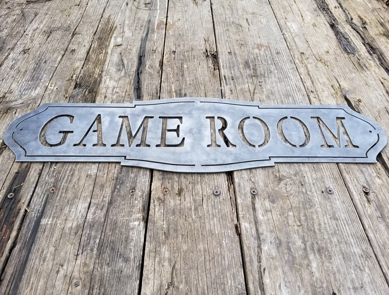 This home decor metal sign reads, "Game Room"