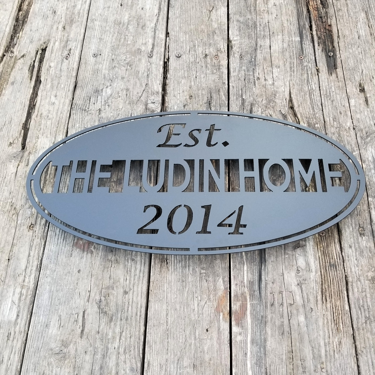This classic Name and date sign powder coated black and reads, " The Ludin Home Est. 2014"