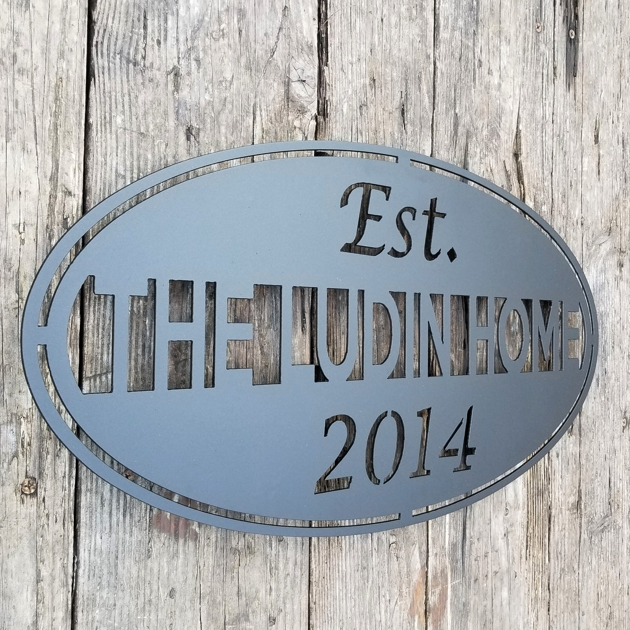 This classic Name and date sign powder coated black and reads, " The Ludin Home Est. 2014"