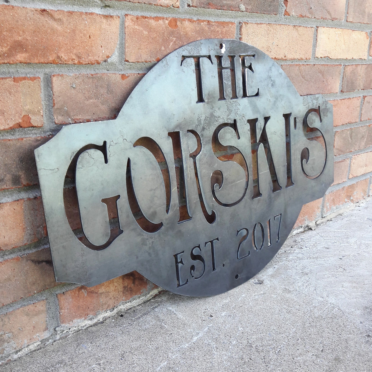 Rustic  raw steel metal sign. The sign reads, " The Gorski's est. 2017"