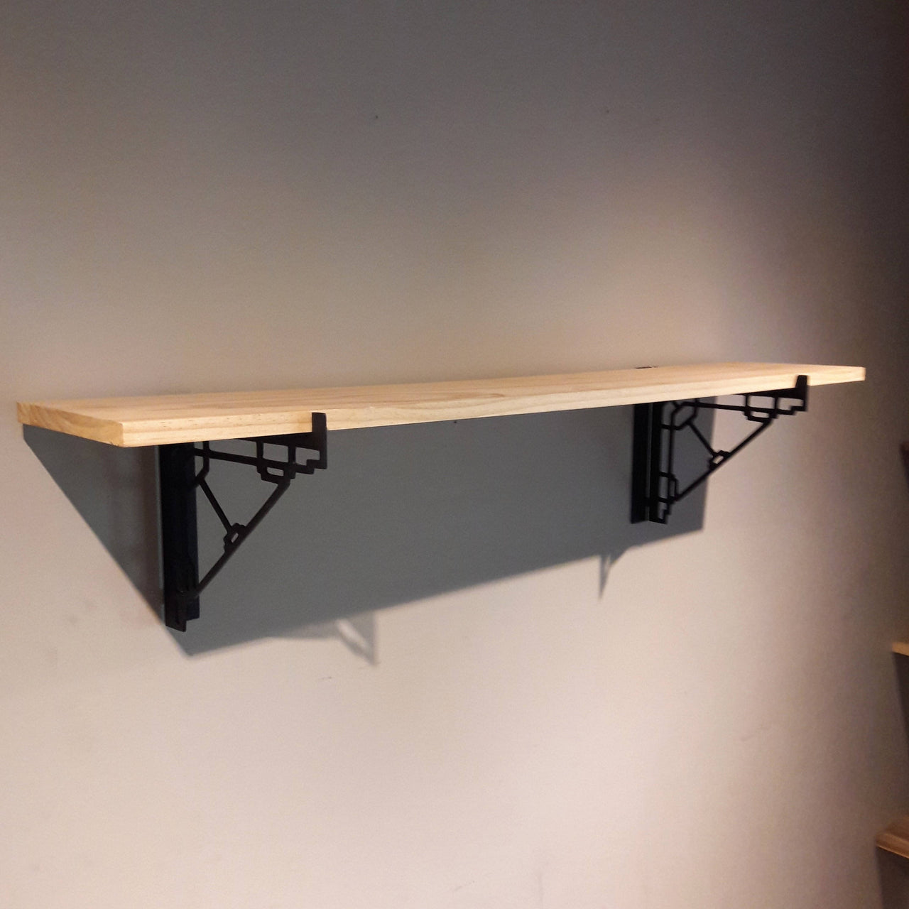 These metal shelf brackets are a contemporary design and fit standard lumber sizes