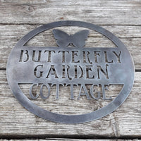 Thumbnail for Round metal sign with the image of a Butterfly at the top and three lines of text. The sign reads, 