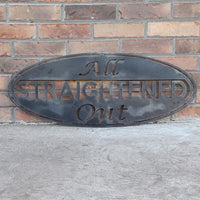 Thumbnail for This metal sign is an oval, it has three lines of text. The sign reads, 