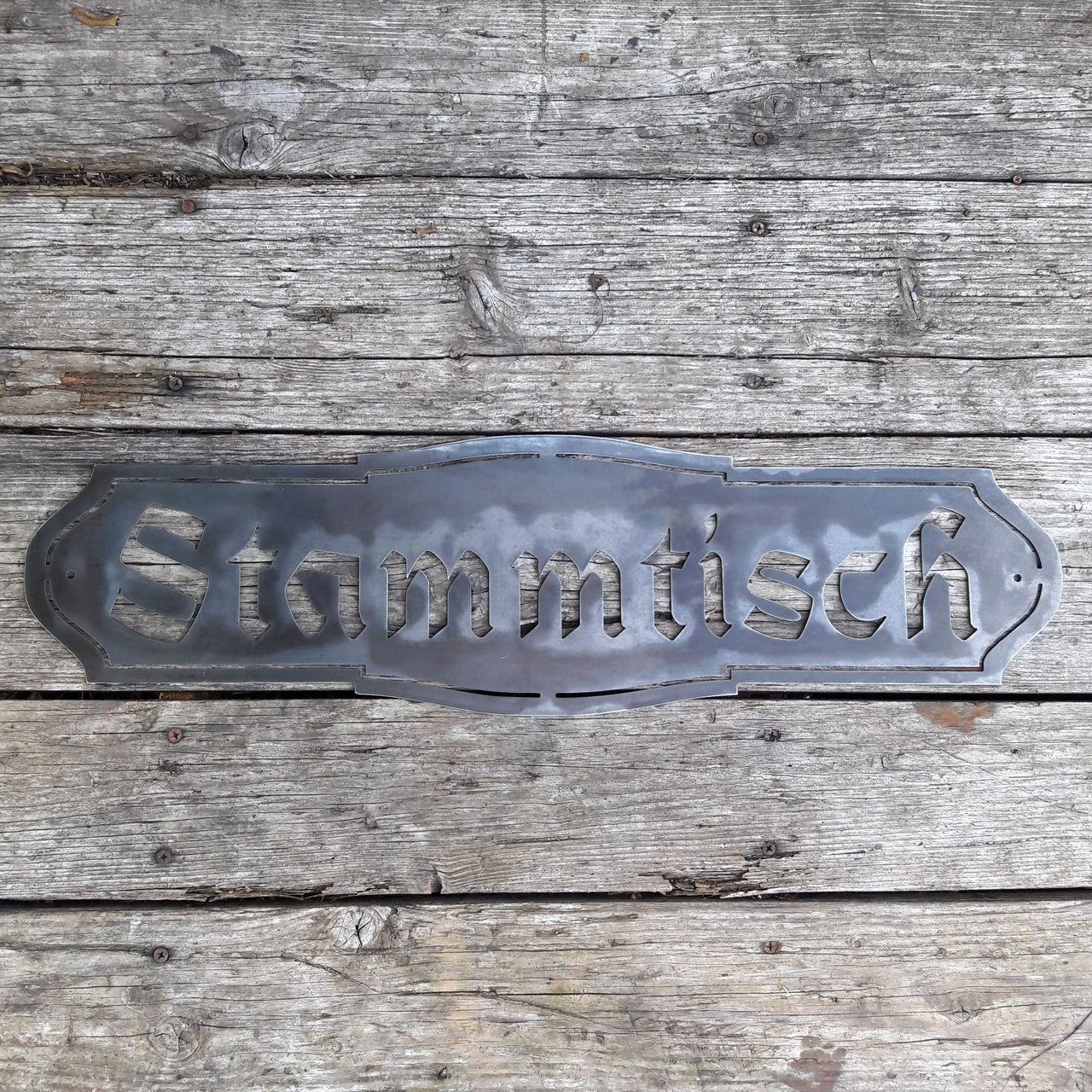 This Metal Sign is written in German and reads, " Stammtisch"